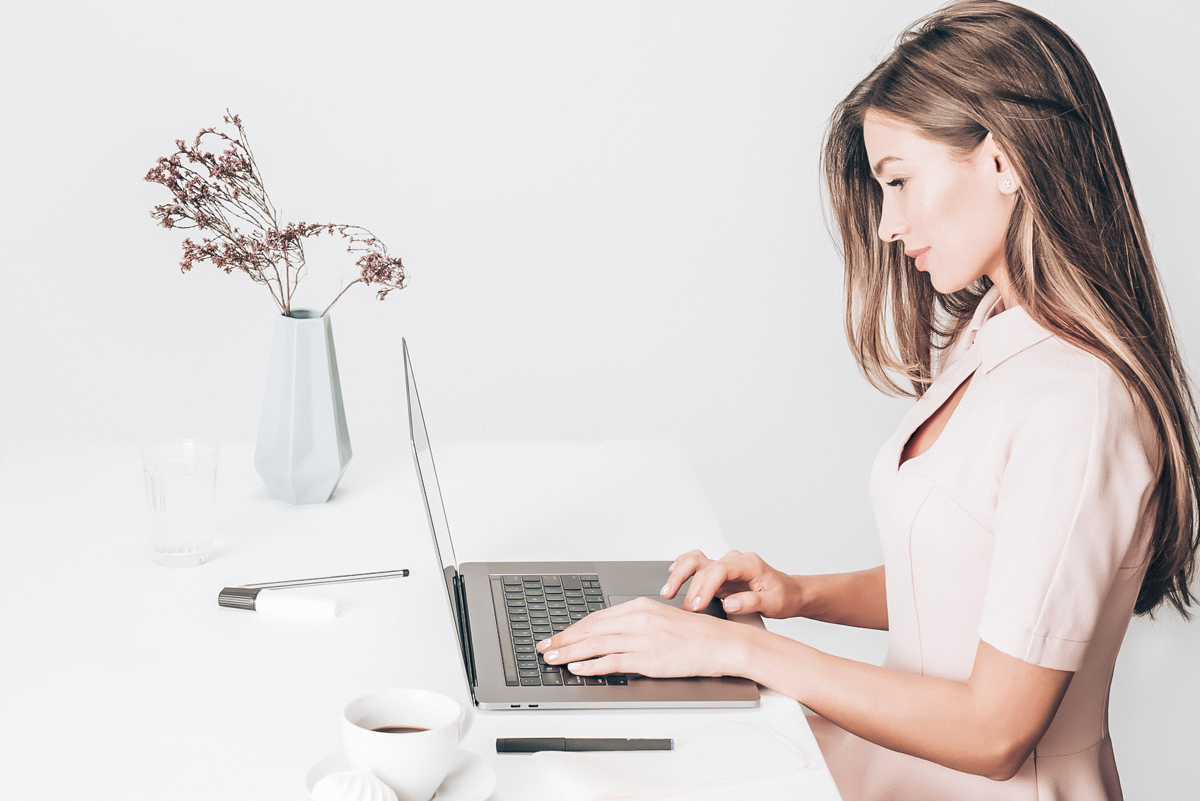 Beautiful woman professional matchmaker working on her laptop